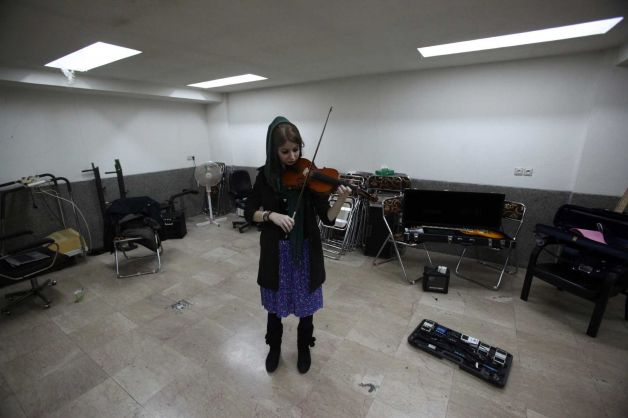  In this picture taken on Friday, Feb. 1, 2013, female Iranian violinist Nastaran Ghaffari practices