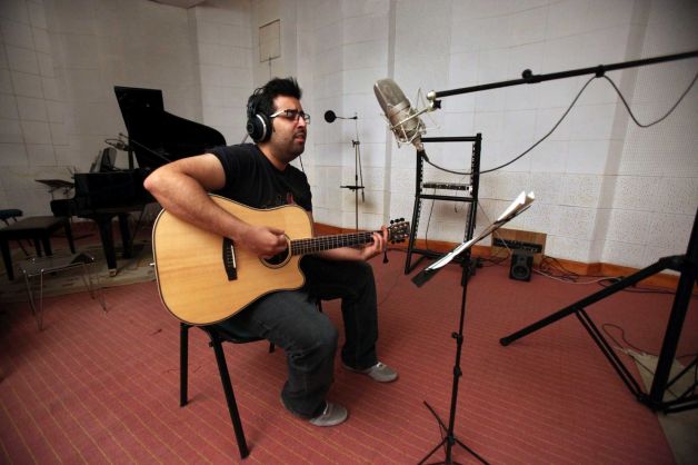  In this picture taken on Tuesday, Feb. 5, 2013, Iranian musician Danial Izadi, a member of a band c